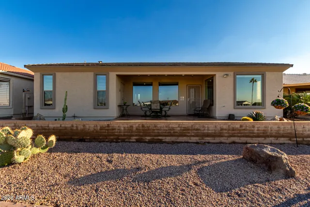 a view of an chairs and table in the patio