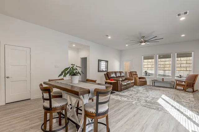 a view of a dining room with furniture window and outside view