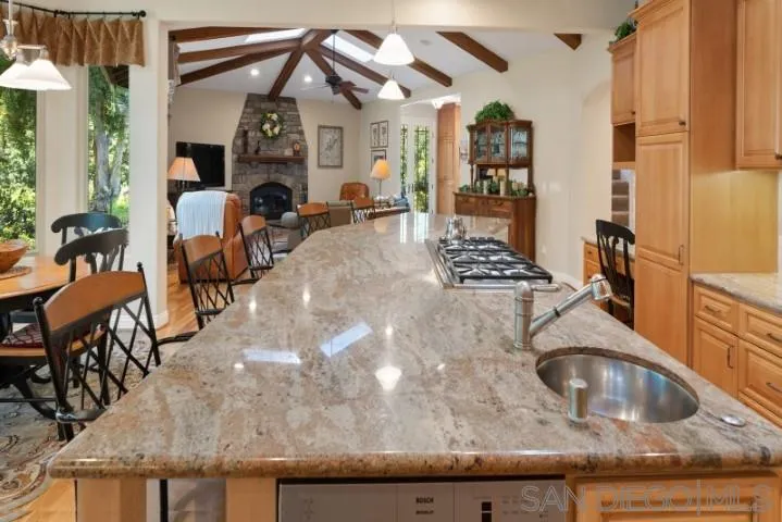 16163 Del Norte Poway, CA 92064 - Photo 14 of 22 a kitchen view with stainless steel appliances granite countertop a sink and cabinets