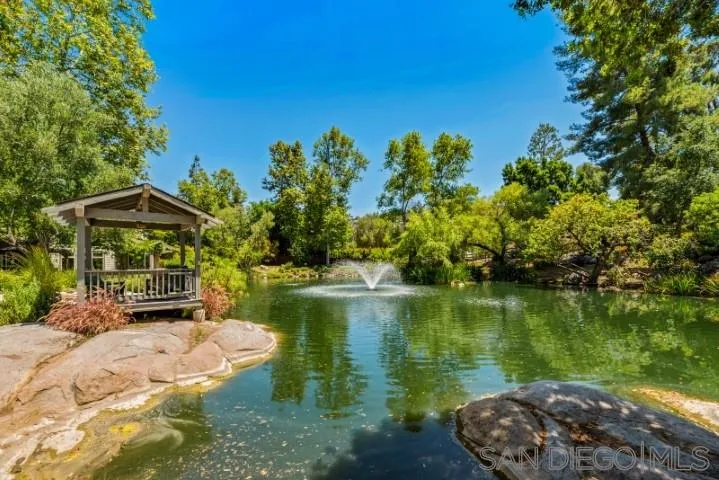 16163 Del Norte Poway, CA 92064 - Photo 20 of 22 a view of a lake with a house in the background