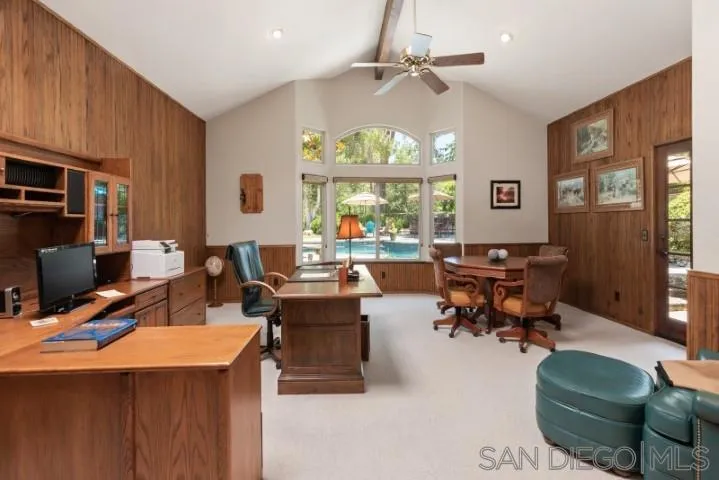 16163 Del Norte Poway, CA 92064 - Photo 8 of 22 a living room with furniture a chandelier and a floor to ceiling window