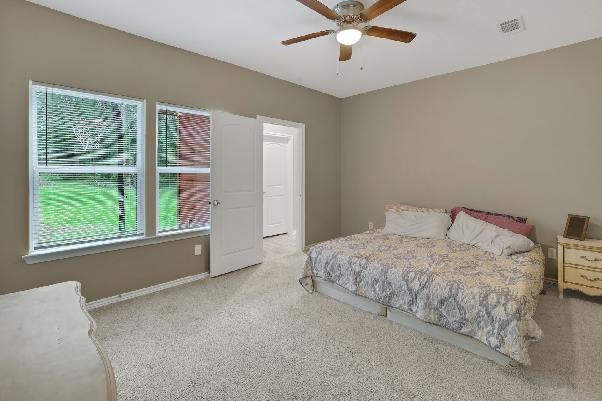 97 Harrell Road Coldspring, TX 77331 - Photo 12 of 31 The primary bedroom with en-suite and walk in closet is located on the first floor