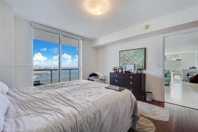 a dining room with furniture and chandelier