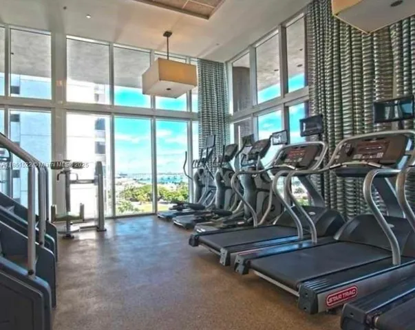 a swimming pool with outdoor seating and yard