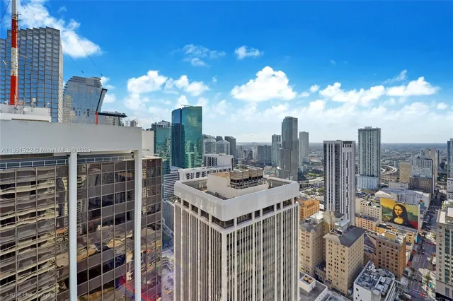 a view of a city from a hallway