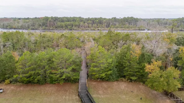a view of a green field with a yard