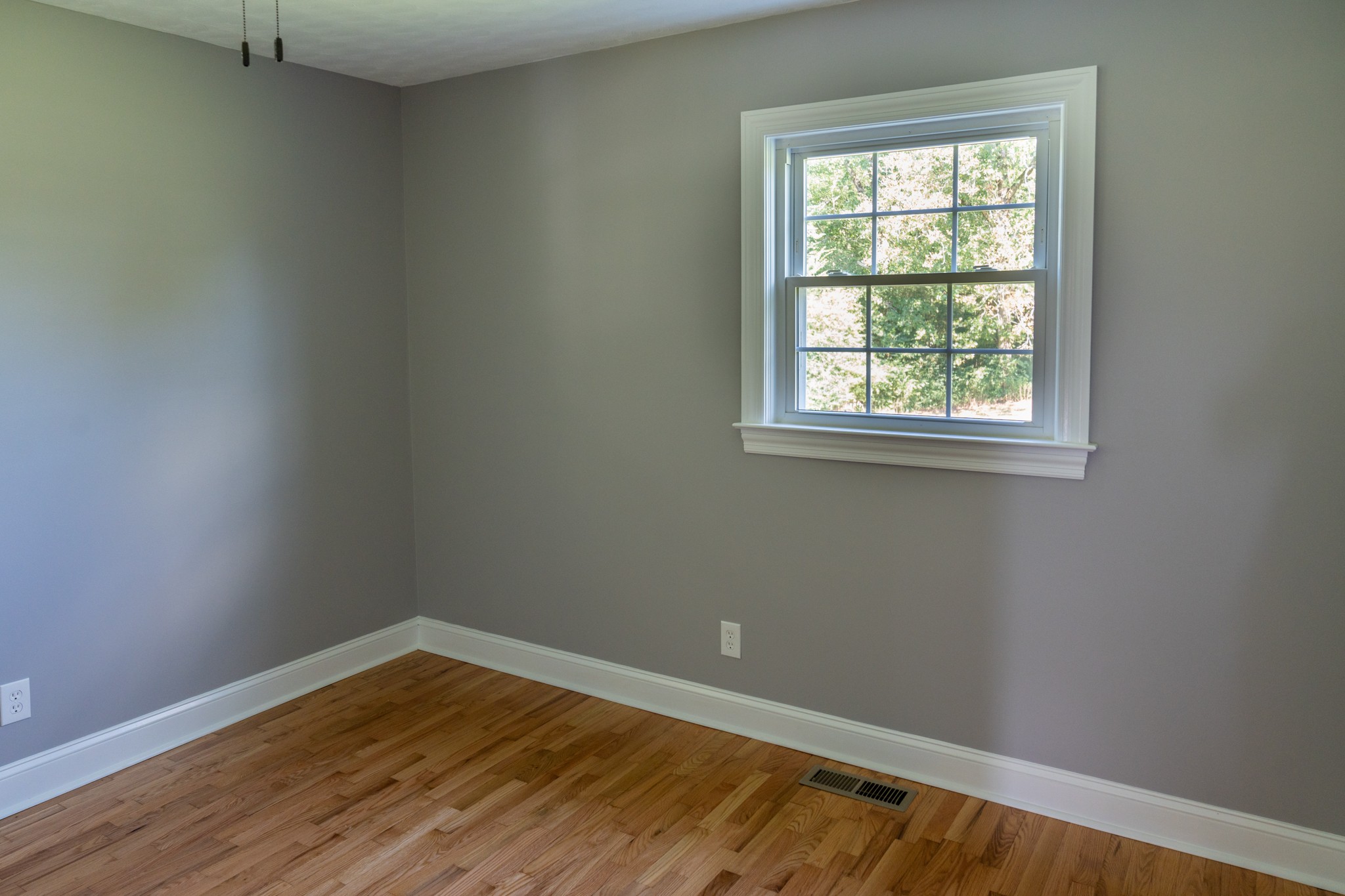 239 Durham Road Leoma, TN 38468 - Photo 9 of 10 an empty room with wooden floor and windows