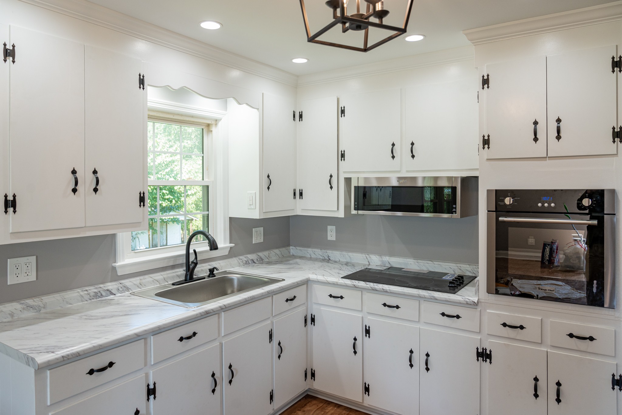 239 Durham Road Leoma, TN 38468 - Photo 10 of 10 a kitchen with granite countertop a sink stainless steel appliances and cabinets