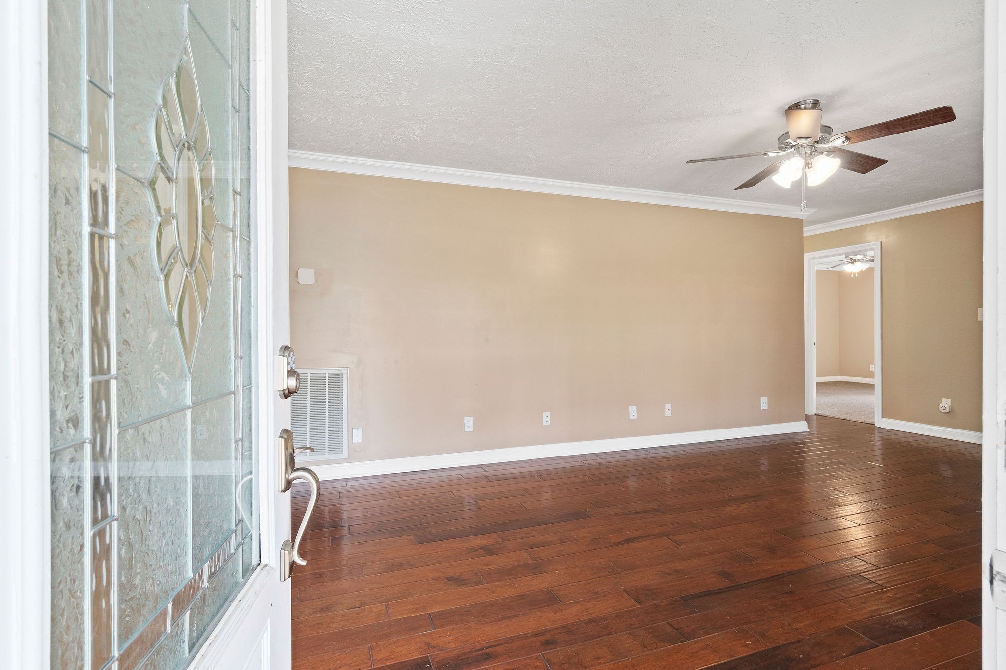 140 Batson Road Cunningham, TN 37052 - Photo 4 of 18 a view of an empty room with wooden floor and a window