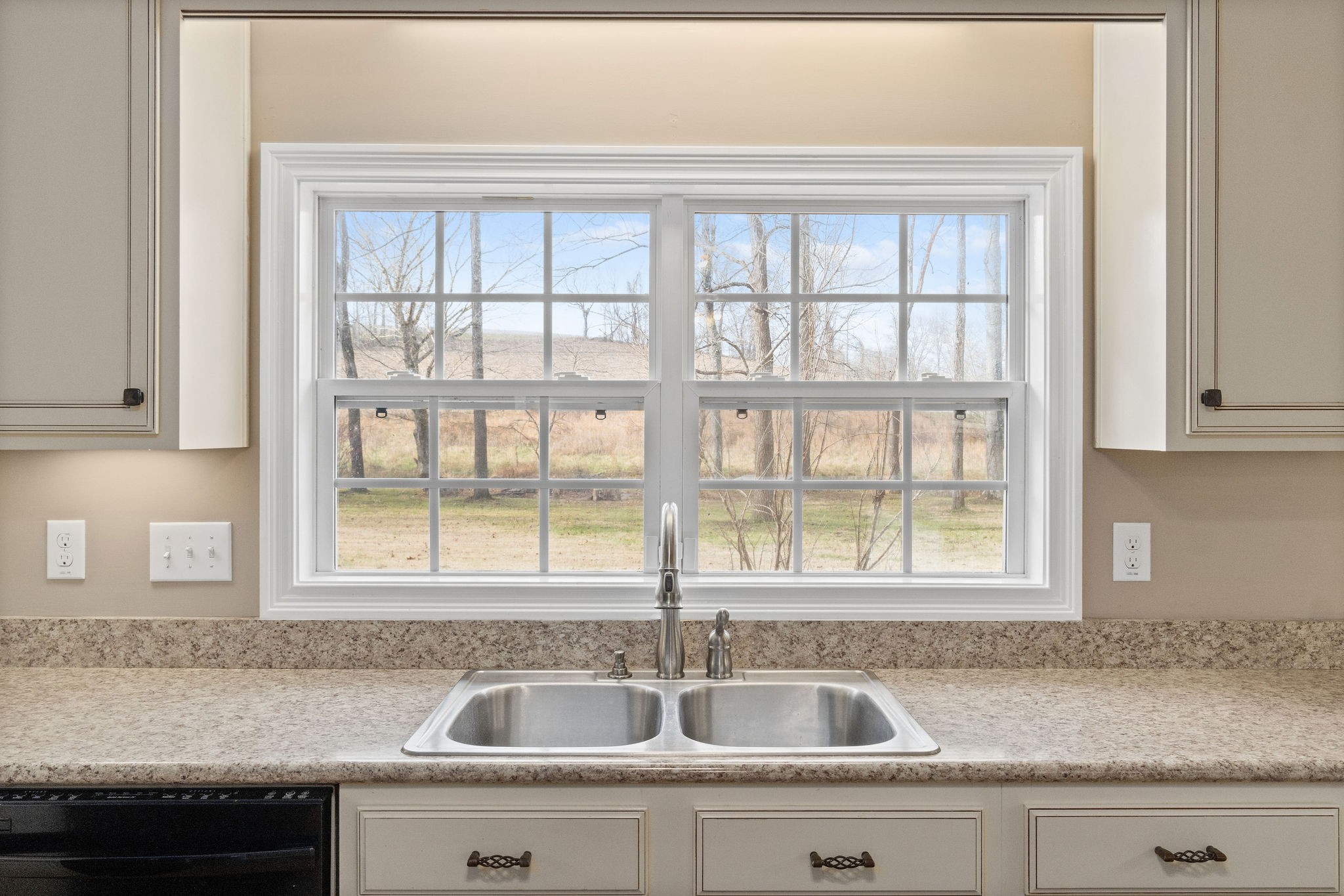 140 Batson Road Cunningham, TN 37052 - Photo 8 of 18 a kitchen with a sink a counter top space and a window