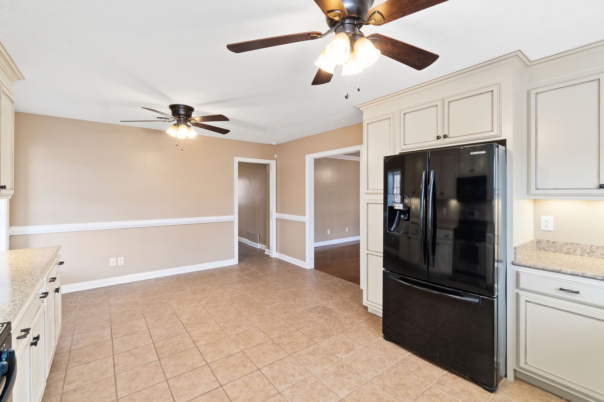 140 Batson Road Cunningham, TN 37052 - Photo 9 of 18 a view of a kitchen with a refrigerator and a ceiling fan