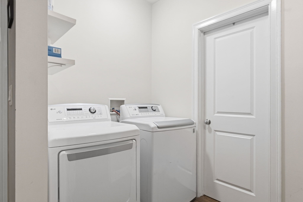 299 Sumner Street, Unit 1 Boston, MA 02128 - Photo 20 of 23 a utility room with dryer and washer