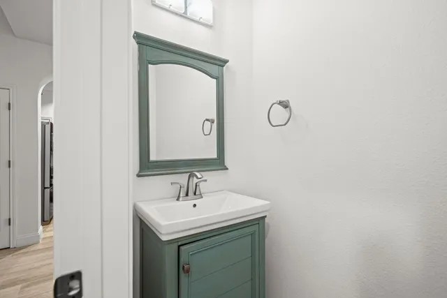 a bathroom with a sink and a mirror