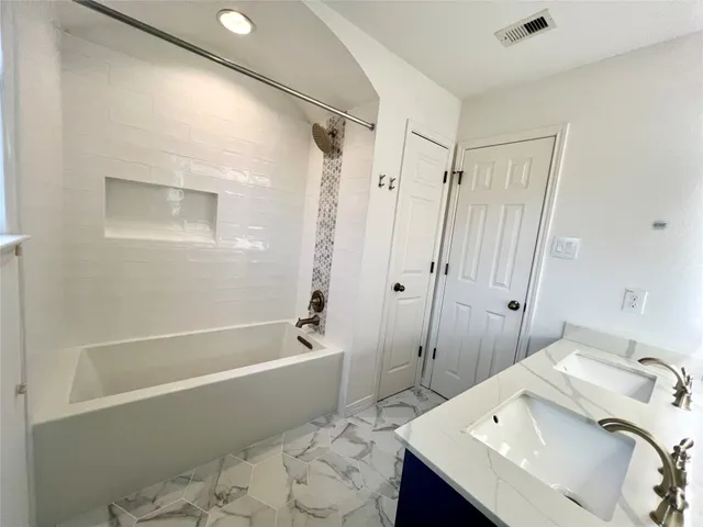 a bathroom with a sink and a tub
