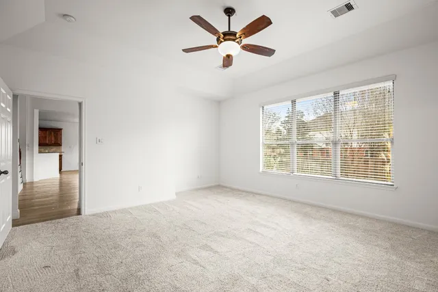 a view of an empty room with a window