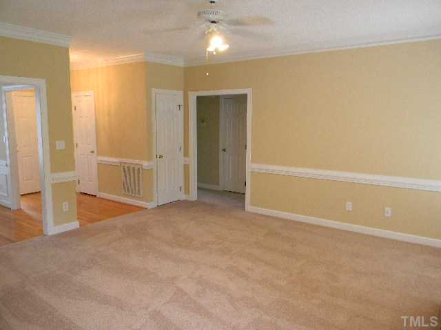 2832 Peebles Road Raleigh, NC 27616 - Photo 3 of 9 an empty room with entrance and door