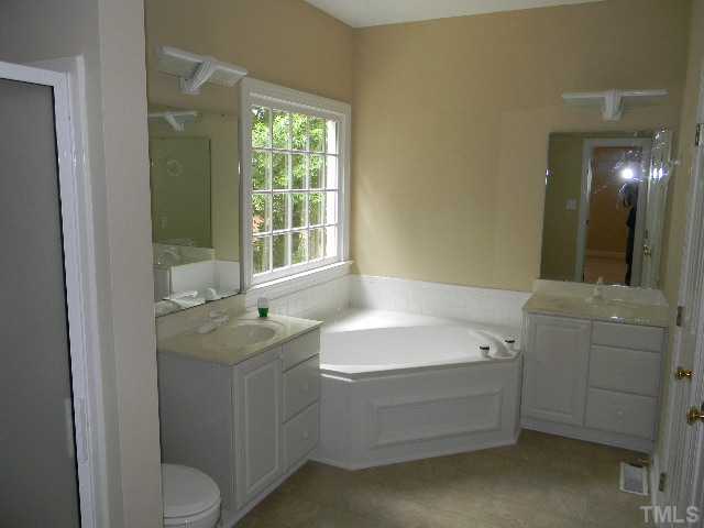 2832 Peebles Road Raleigh, NC 27616 - Photo 8 of 9 a bathroom with a sink a toilet and tub