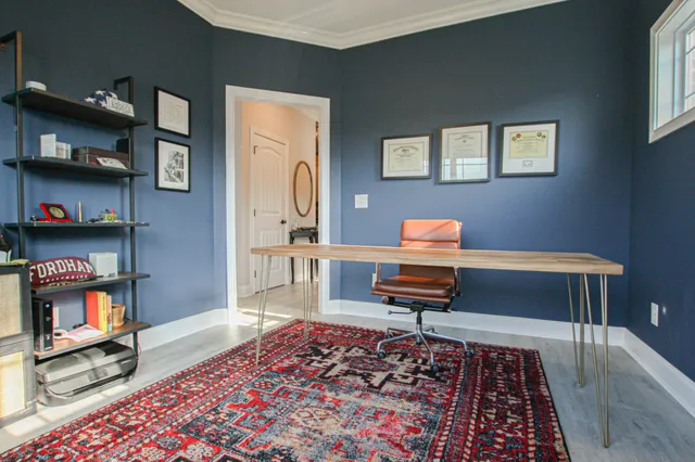 a living room with furniture and a rug