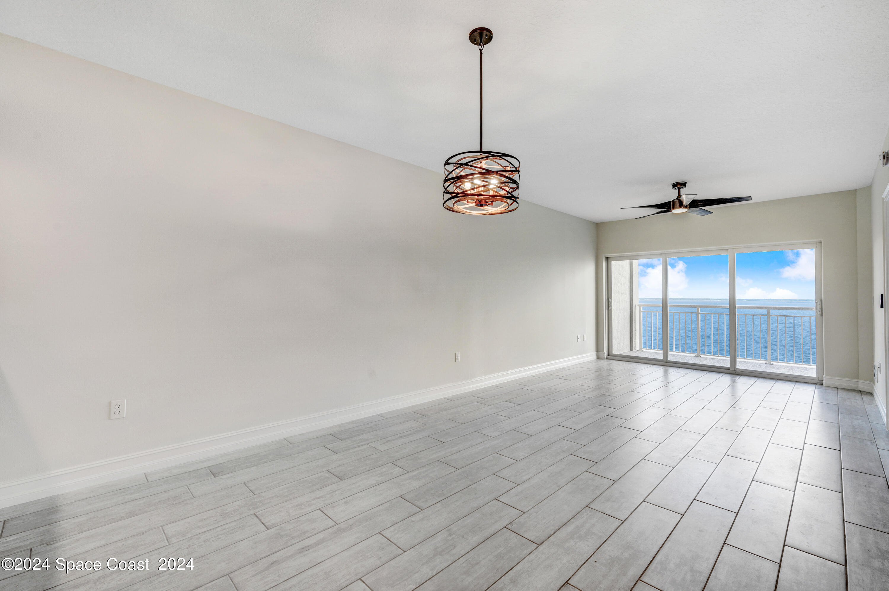 1805 Riverside Drive, Unit 606 Titusville, FL 32780 - Photo 14 of 40 a view of empty room with windows