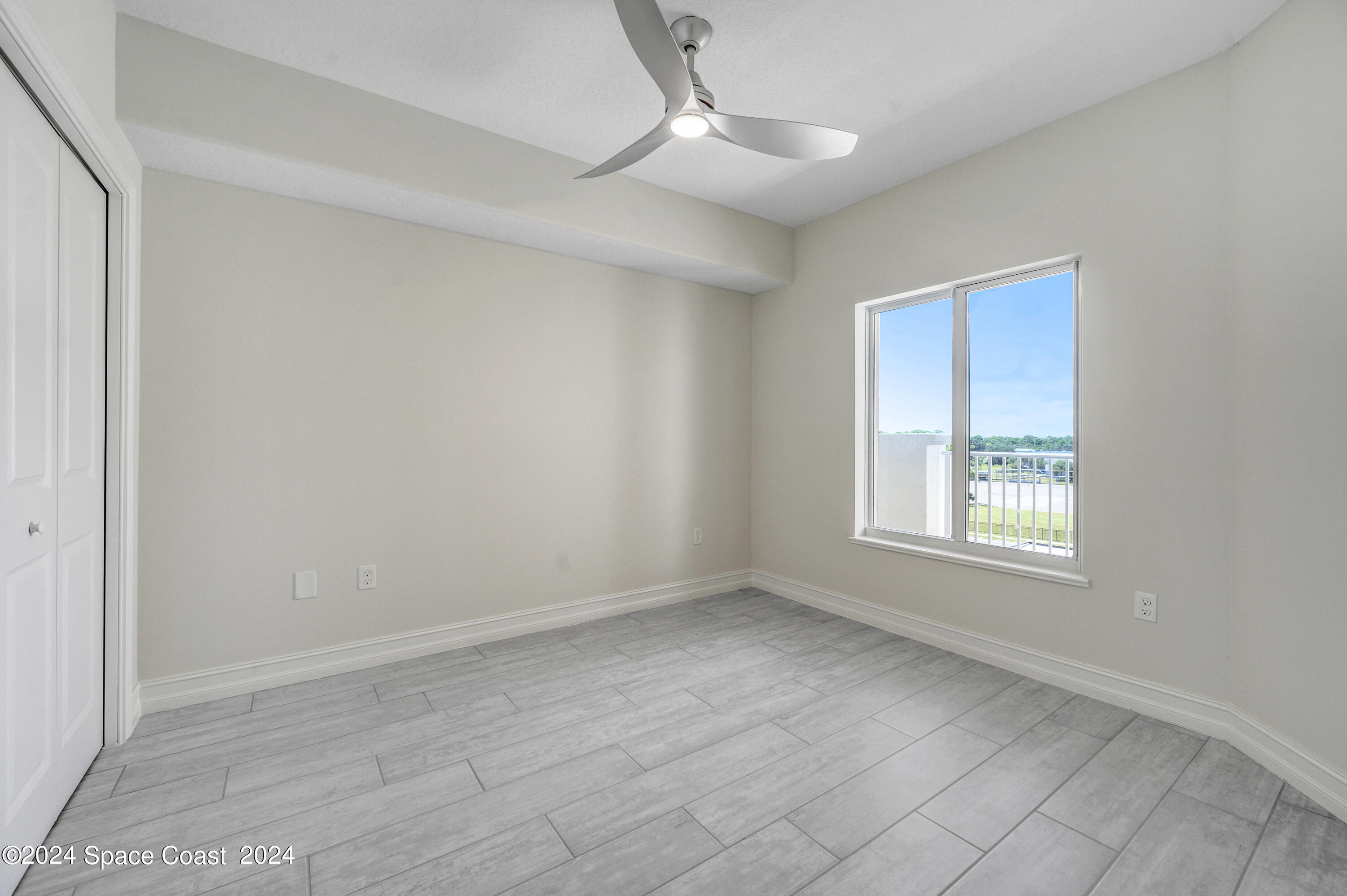 1805 Riverside Drive, Unit 606 Titusville, FL 32780 - Photo 20 of 40 a view of an empty room with a window
