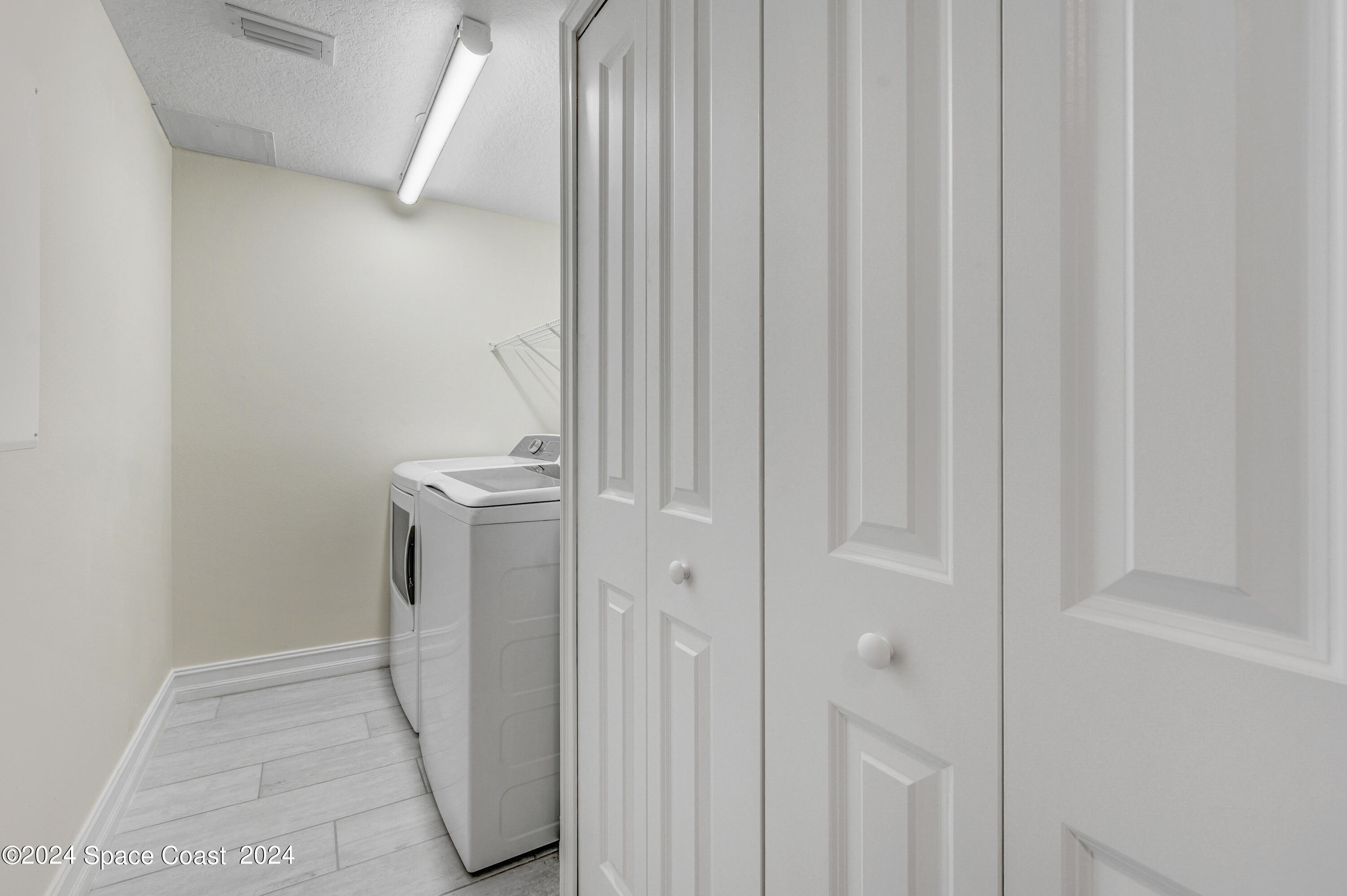 1805 Riverside Drive, Unit 606 Titusville, FL 32780 - Photo 24 of 40 a bathroom with a sink a toilet and shower