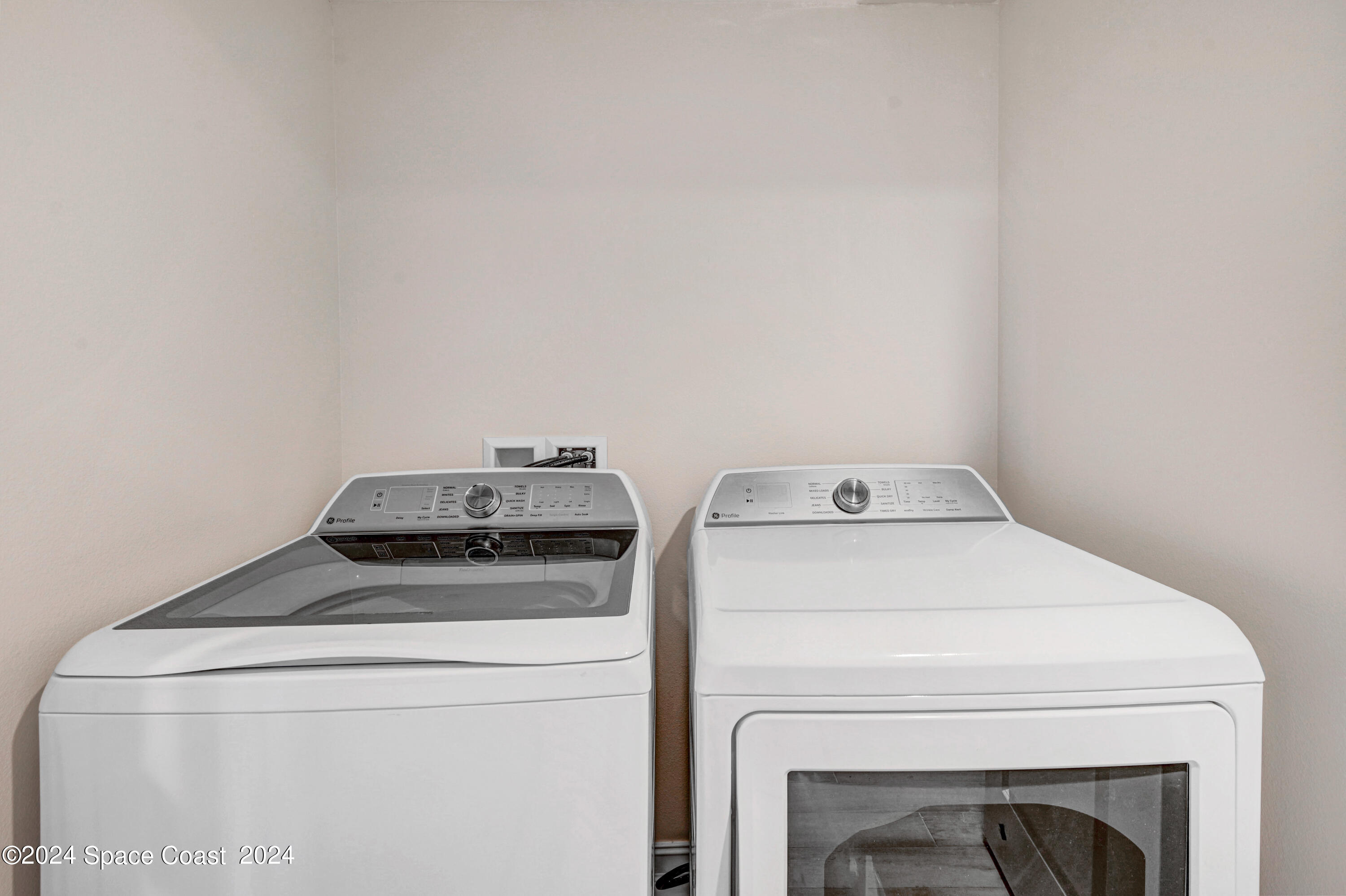 1805 Riverside Drive, Unit 606 Titusville, FL 32780 - Photo 25 of 40 a utility room with dryer and washer