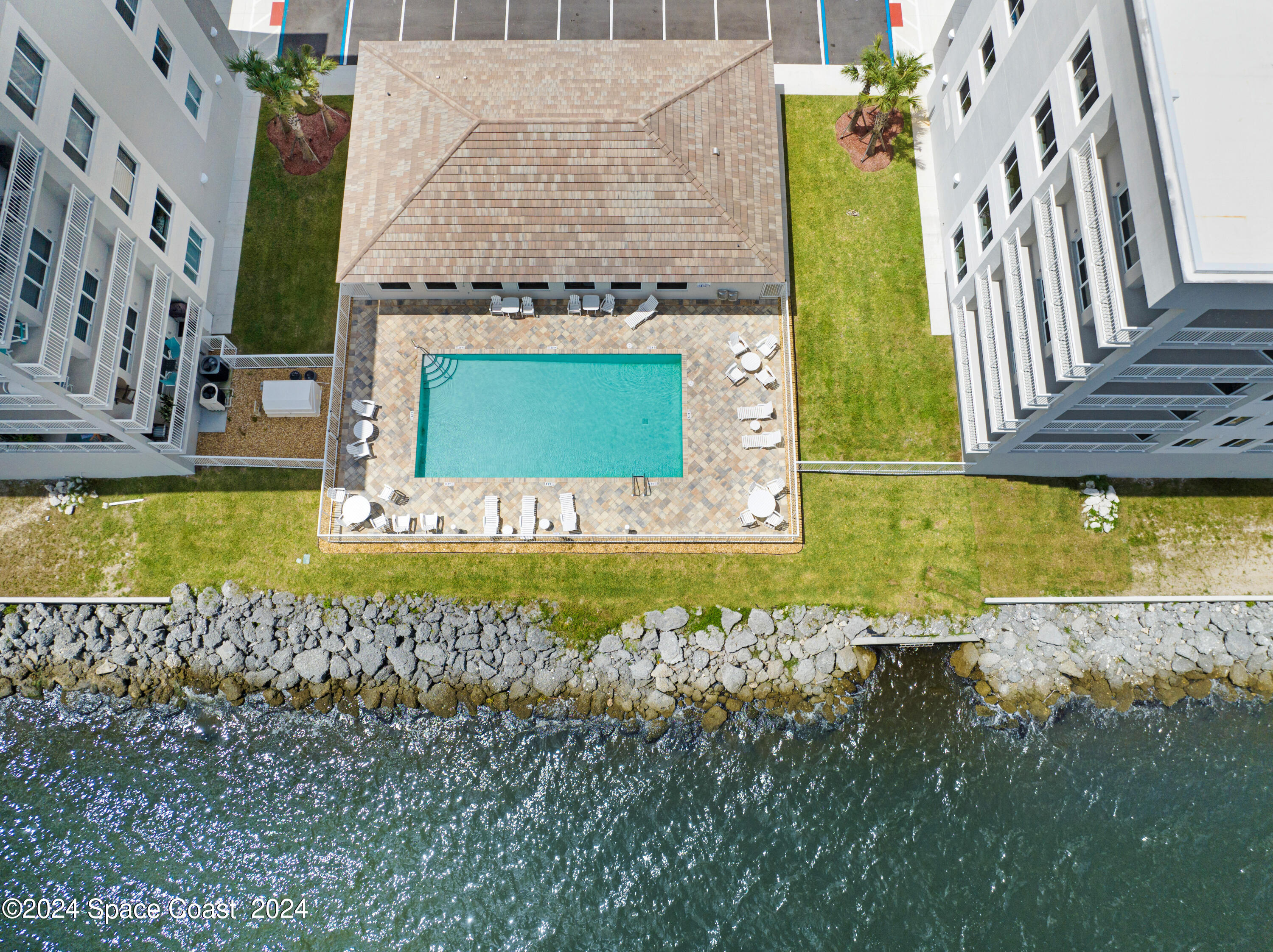 1805 Riverside Drive, Unit 606 Titusville, FL 32780 - Photo 31 of 40 a view of a house with a swimming pool