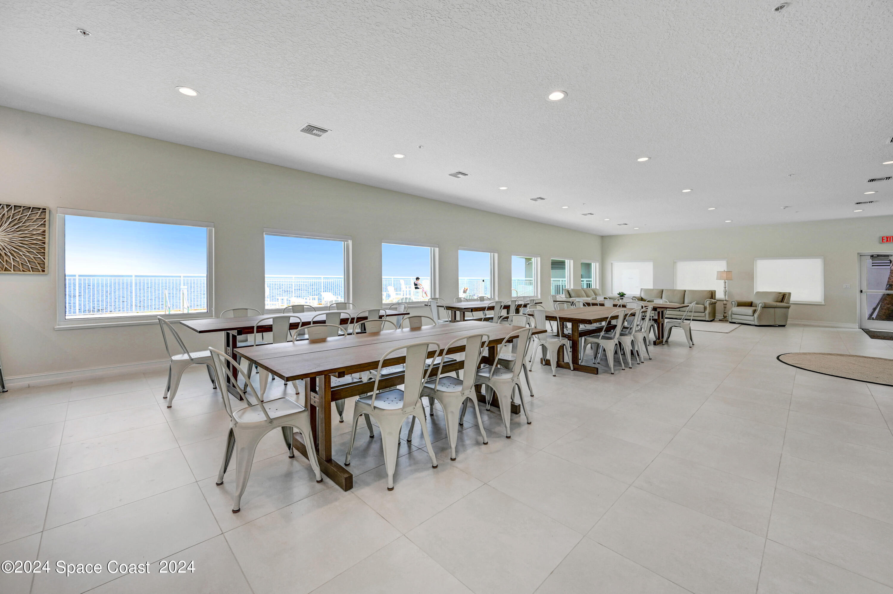 1805 Riverside Drive, Unit 606 Titusville, FL 32780 - Photo 33 of 40 a room with lots of table and chairs