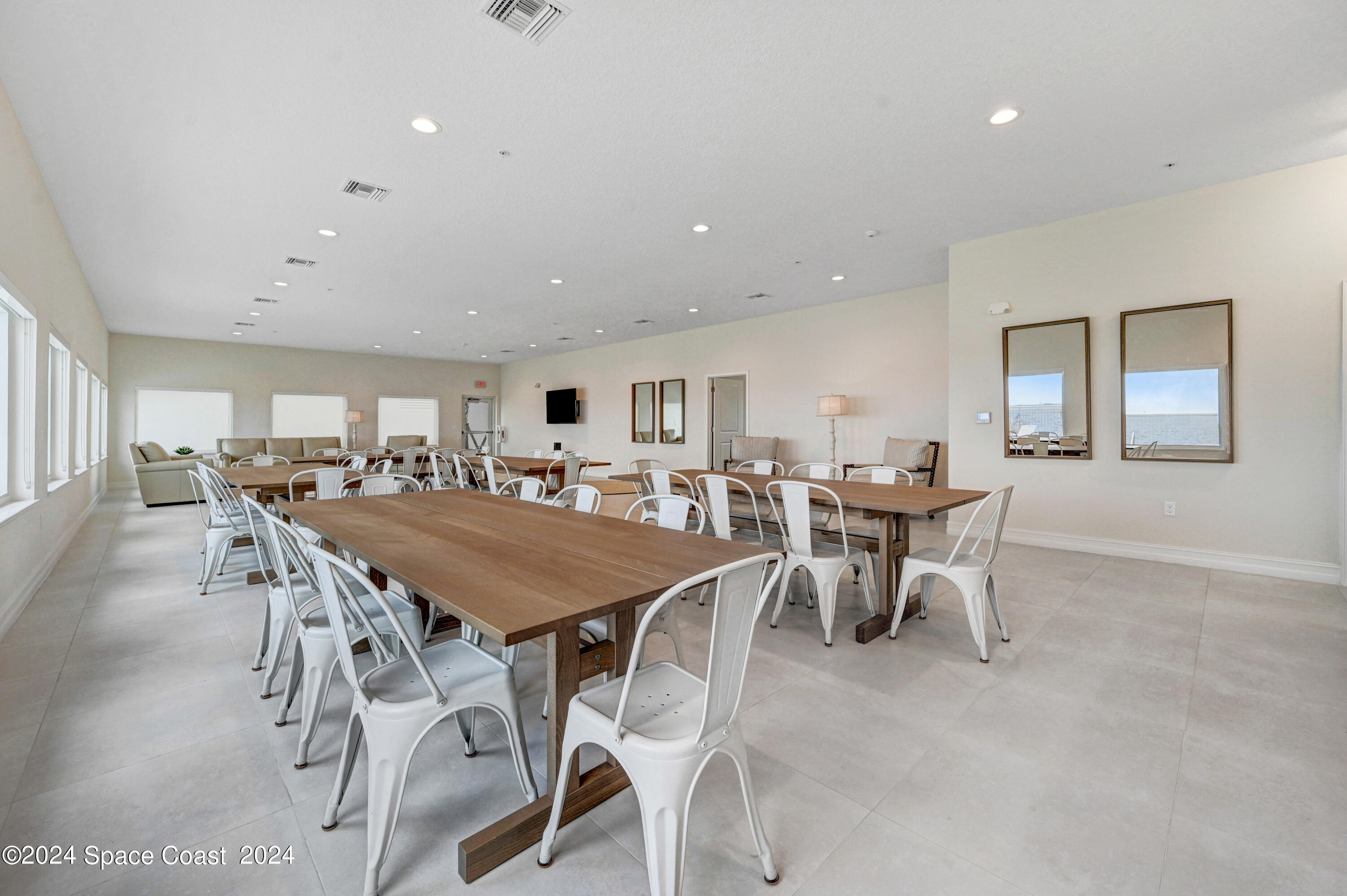 1805 Riverside Drive, Unit 606 Titusville, FL 32780 - Photo 35 of 40 a view of a dining area with furniture and chandelier