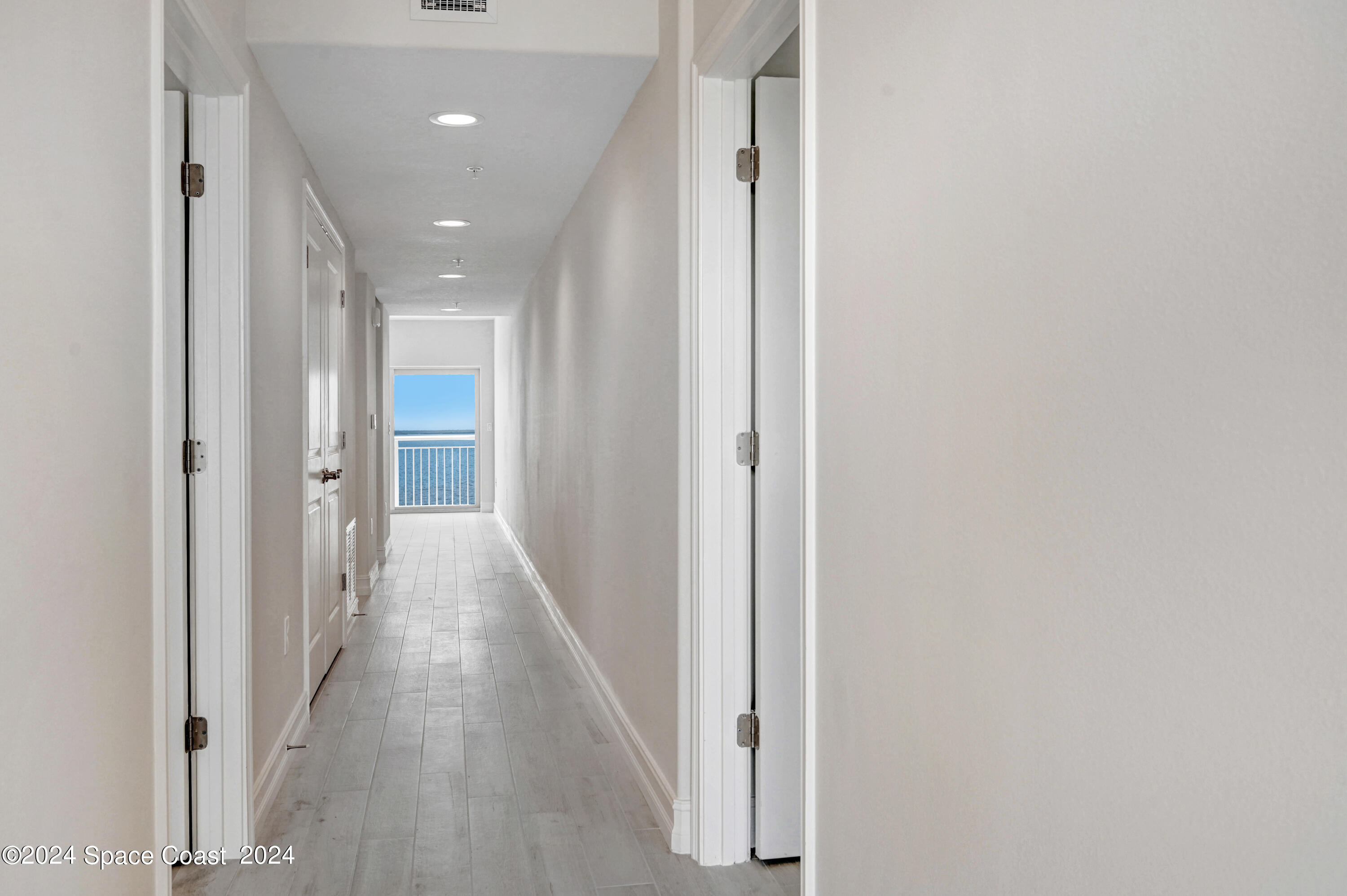 1805 Riverside Drive, Unit 606 Titusville, FL 32780 - Photo 6 of 40 a view of a hallway with wooden floor