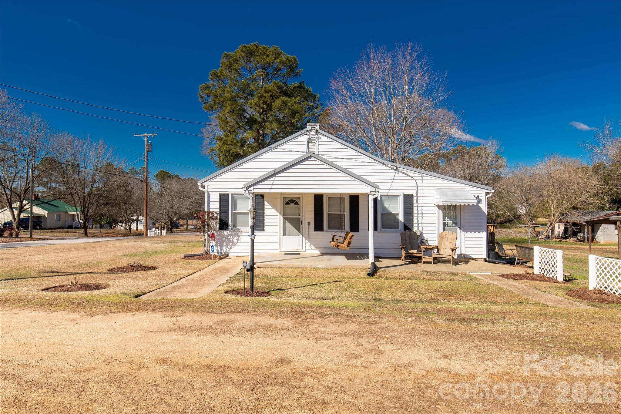 1227 Laurel Avenue Lancaster, SC 29720 - Photo 1 of 48 a house with trees in front of it