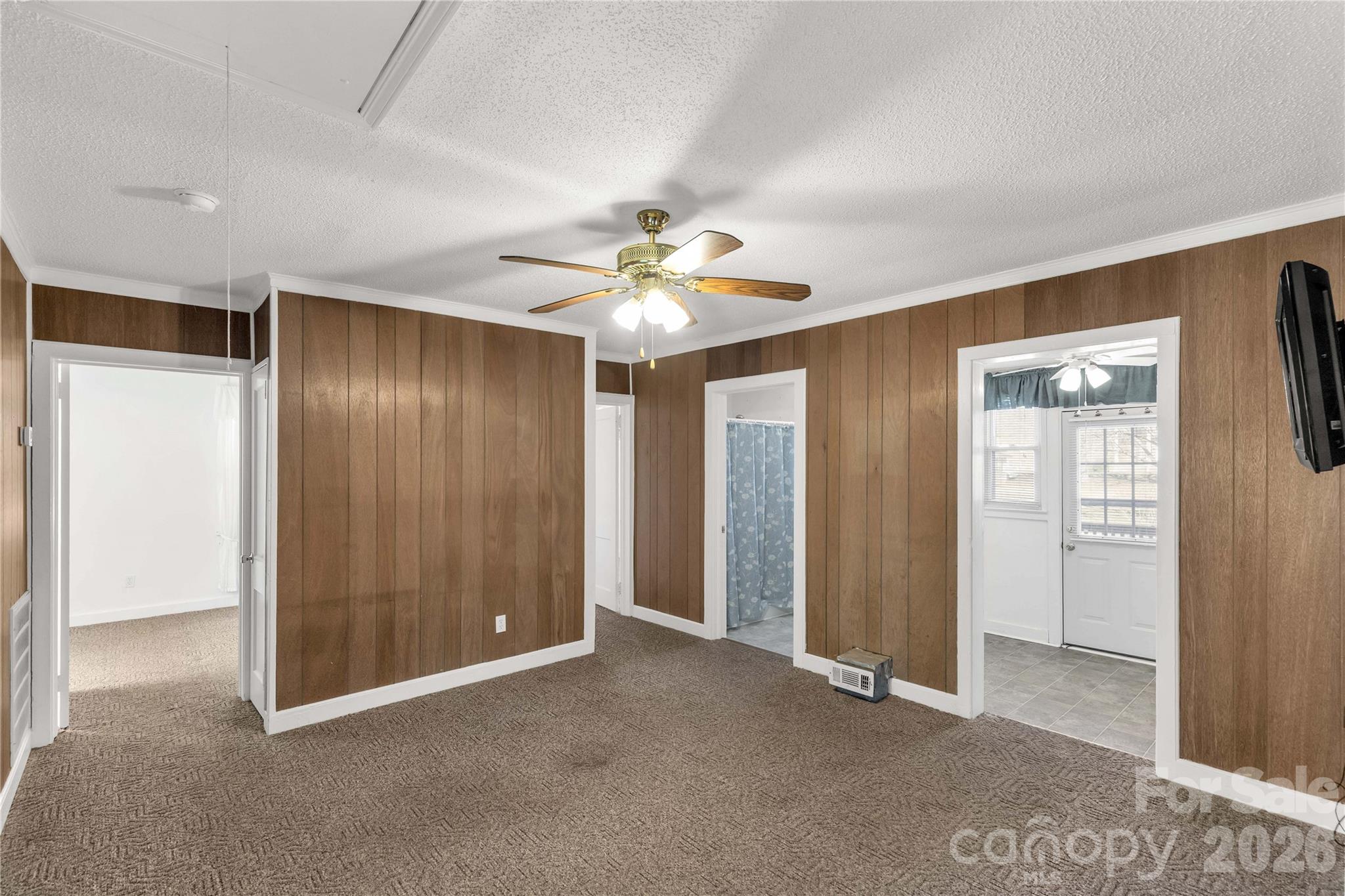 1227 Laurel Avenue Lancaster, SC 29720 - Photo 14 of 48 an empty room with closet and a ceiling fan