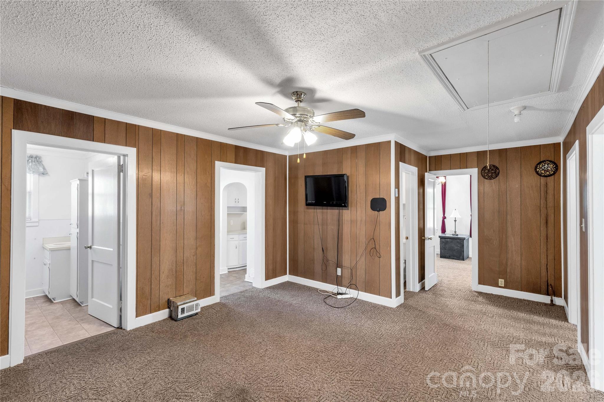 1227 Laurel Avenue Lancaster, SC 29720 - Photo 15 of 48 a view of a livingroom with a ceiling fan window and a ceiling fan