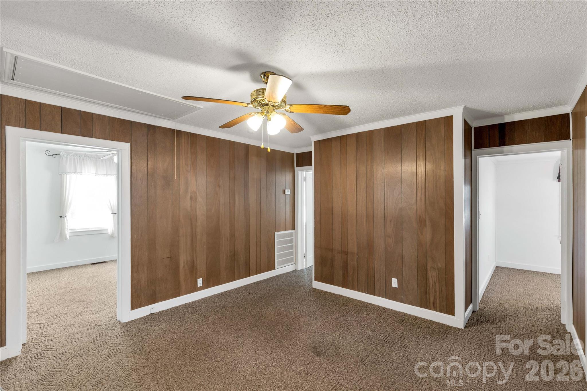 1227 Laurel Avenue Lancaster, SC 29720 - Photo 16 of 48 an empty room with closet and a ceiling fan