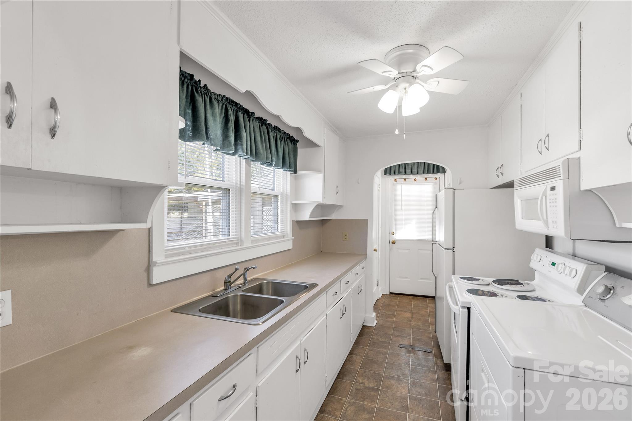 1227 Laurel Avenue Lancaster, SC 29720 - Photo 20 of 48 a kitchen with a sink cabinets and window