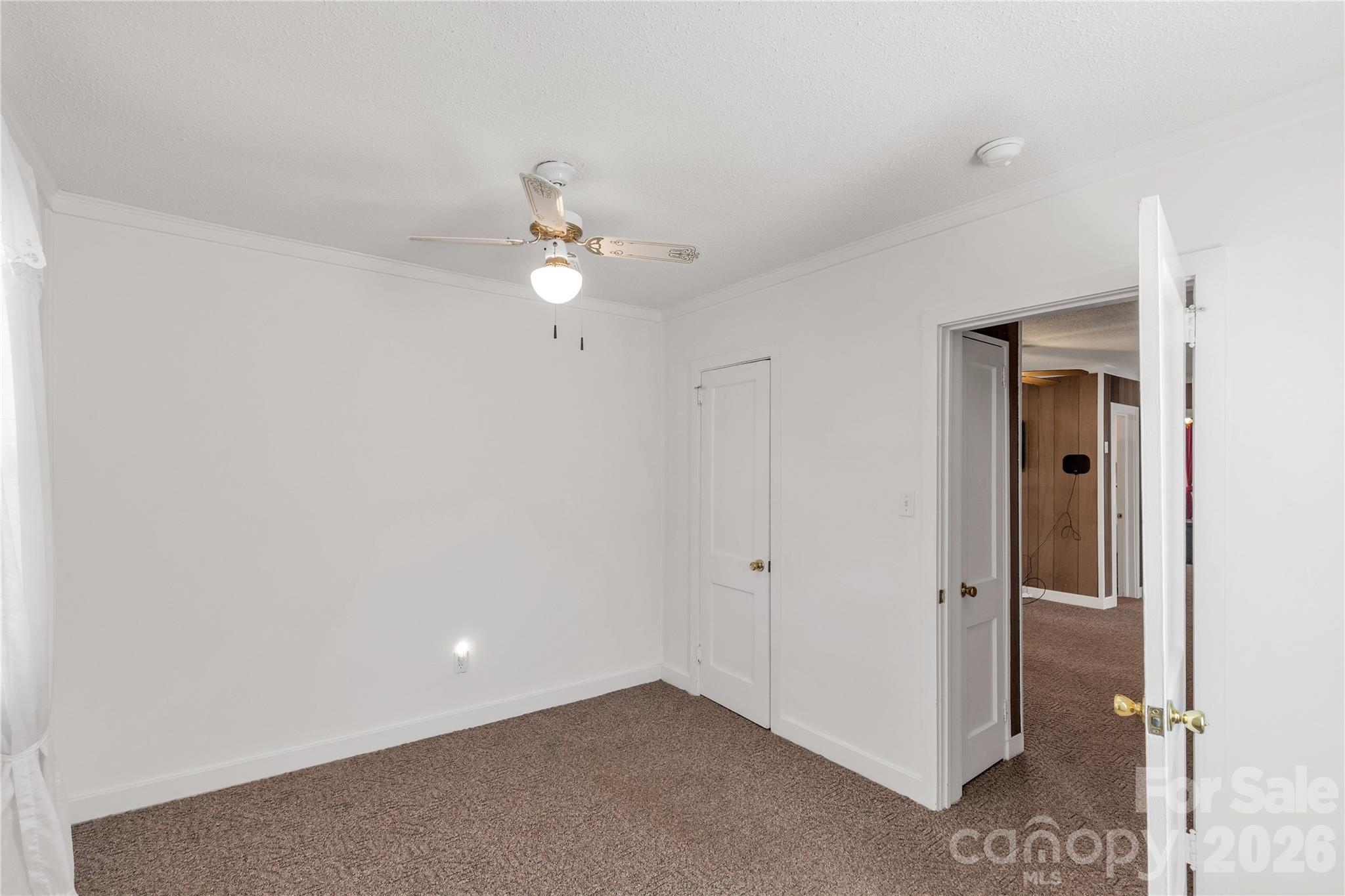 1227 Laurel Avenue Lancaster, SC 29720 - Photo 27 of 48 an empty room with fan and entrance