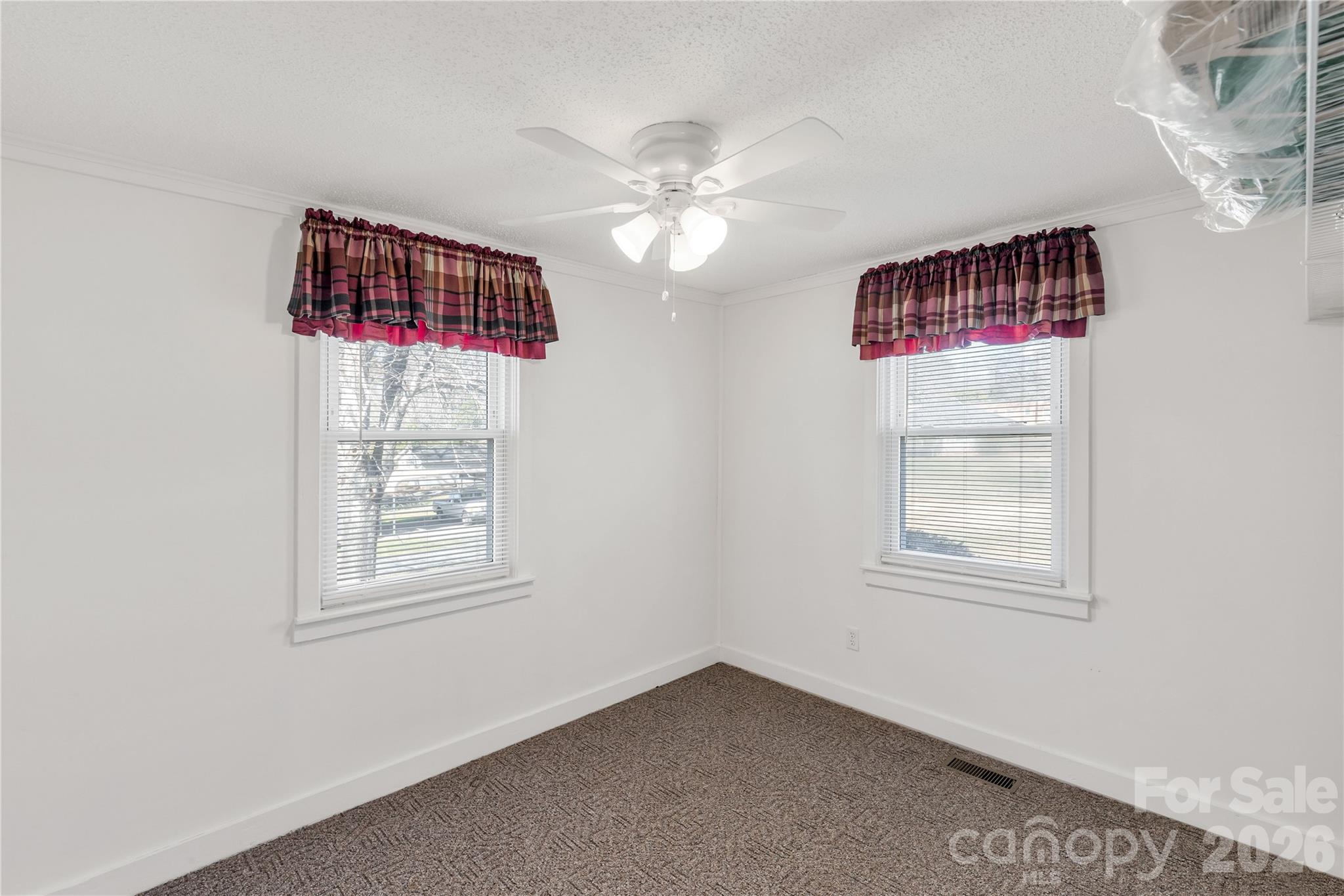 1227 Laurel Avenue Lancaster, SC 29720 - Photo 28 of 48 a view of a livingroom with a fan & a window