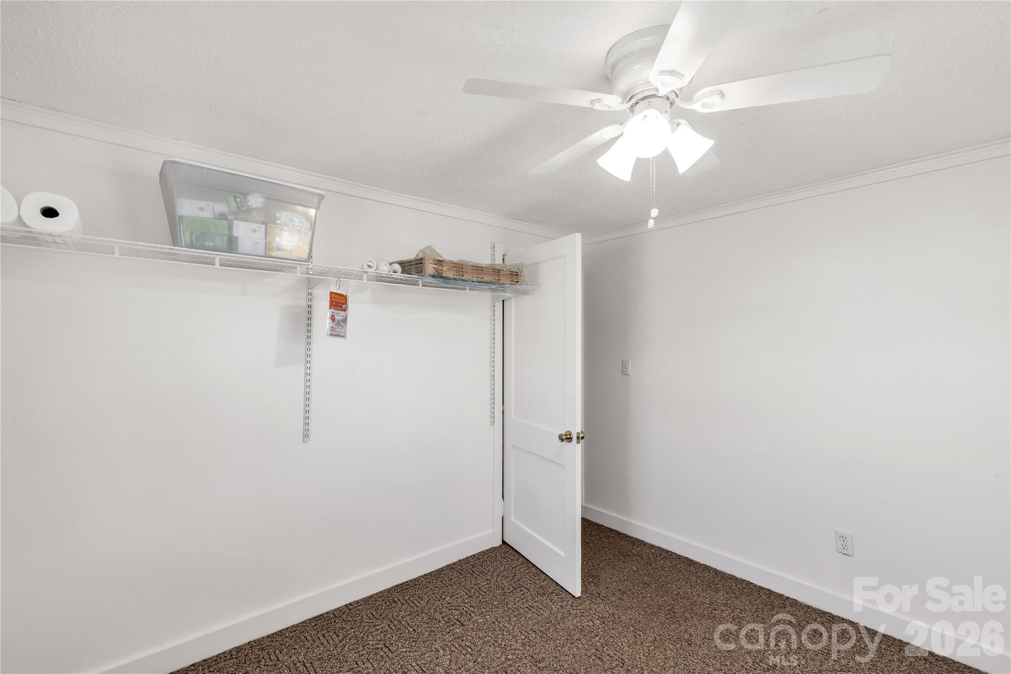 1227 Laurel Avenue Lancaster, SC 29720 - Photo 29 of 48 an empty room with windows and fan