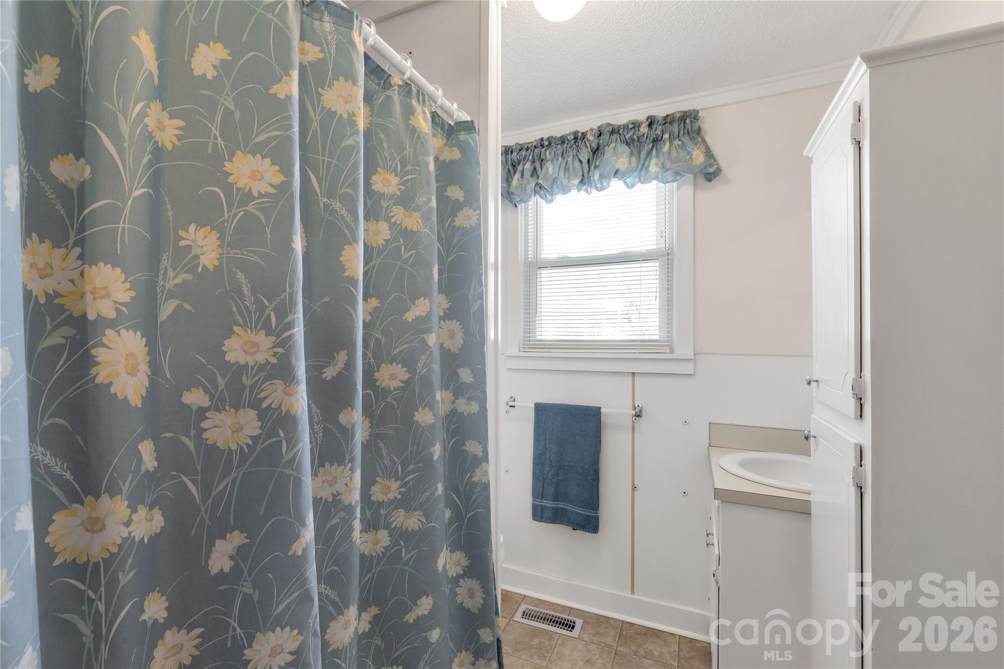 1227 Laurel Avenue Lancaster, SC 29720 - Photo 30 of 48 a bathroom with a bathtub and shower
