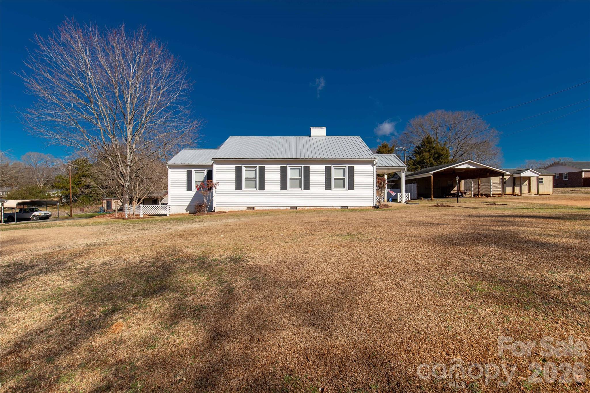 1227 Laurel Avenue Lancaster, SC 29720 - Photo 3 of 48 a view of a town with large trees