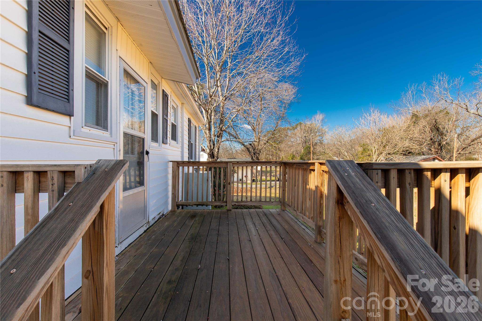 1227 Laurel Avenue Lancaster, SC 29720 - Photo 33 of 48 a balcony with wooden floor and fence