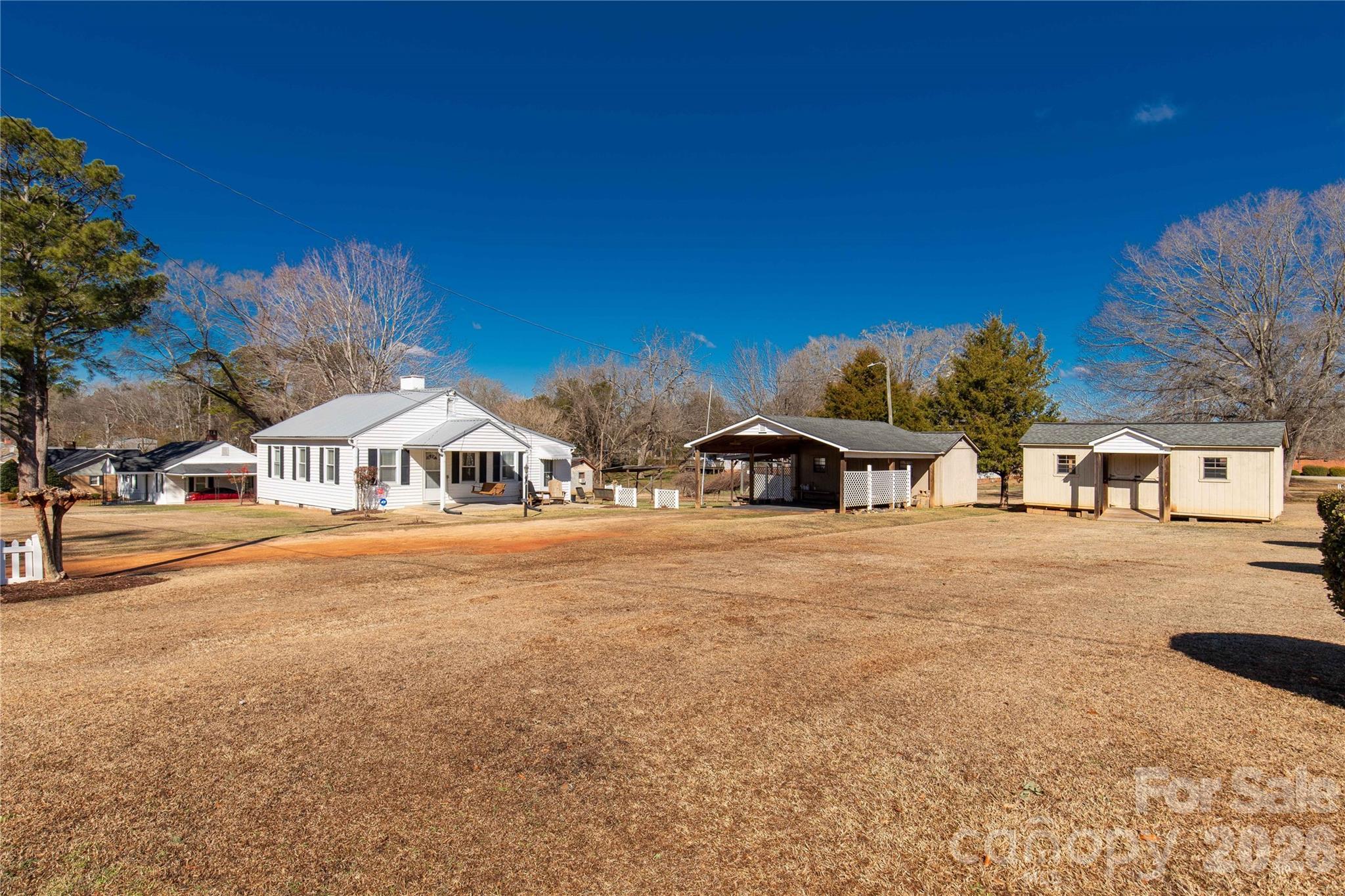 1227 Laurel Avenue Lancaster, SC 29720 - Photo 36 of 48 a front view of a house with a yard and garage