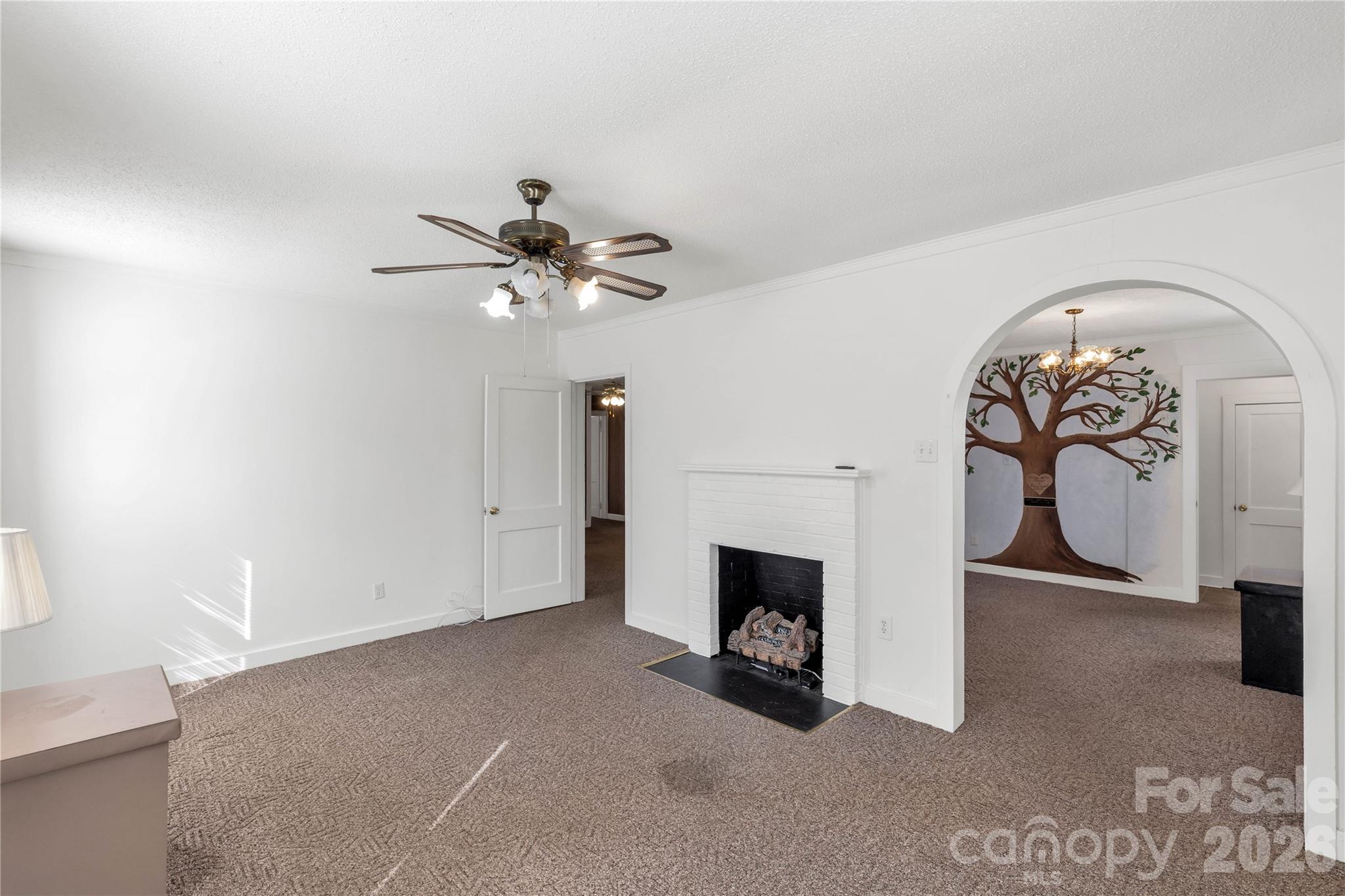 1227 Laurel Avenue Lancaster, SC 29720 - Photo 10 of 48 a view of an empty room with a fireplace