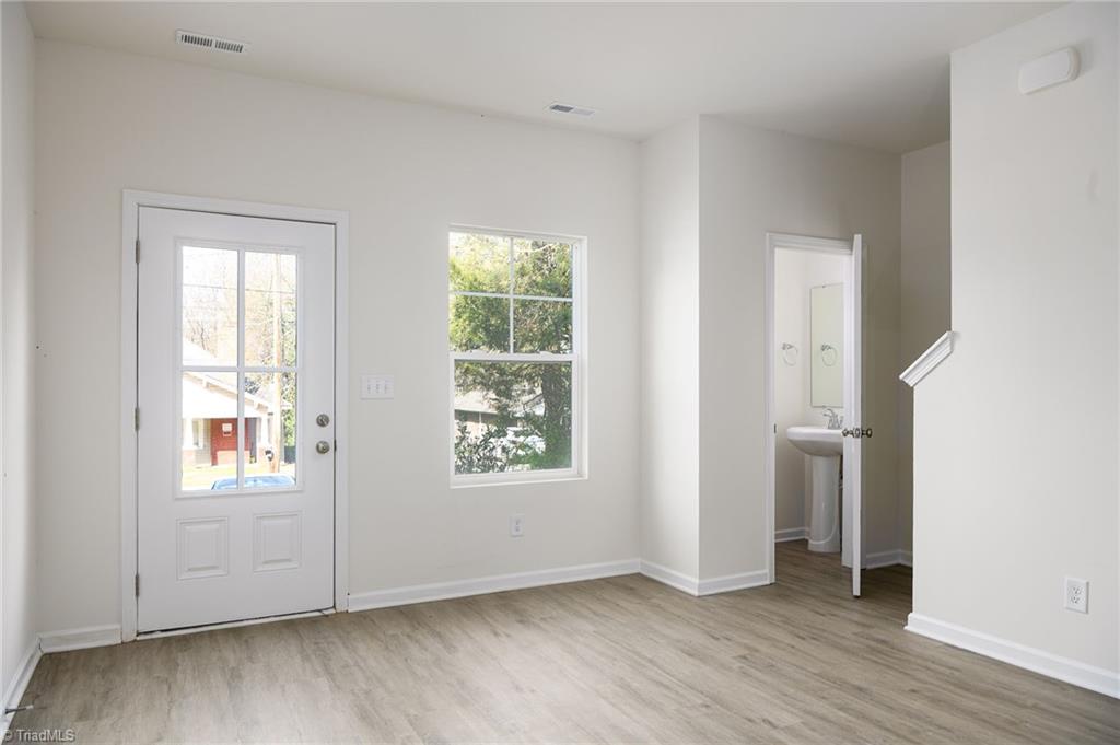 711 Fairview Street, Unit A High Point, NC 27260 - Photo 6 of 18 Living Room w/ Half Bath