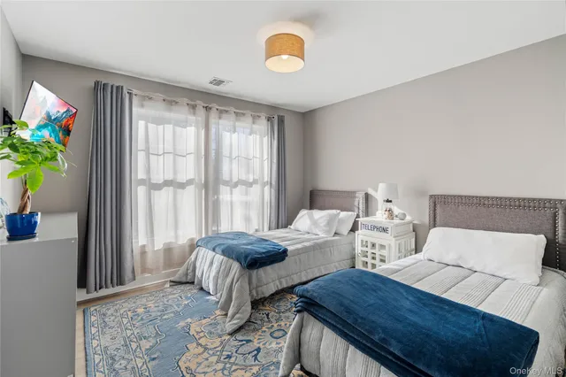 a bedroom with furniture and a window