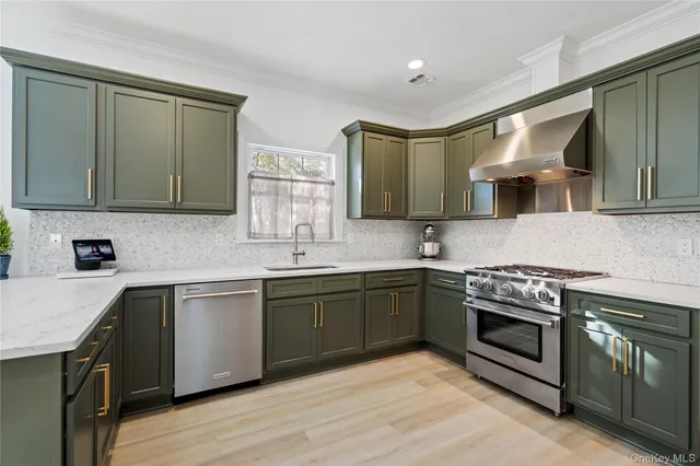 a kitchen with a sink stove and cabinets