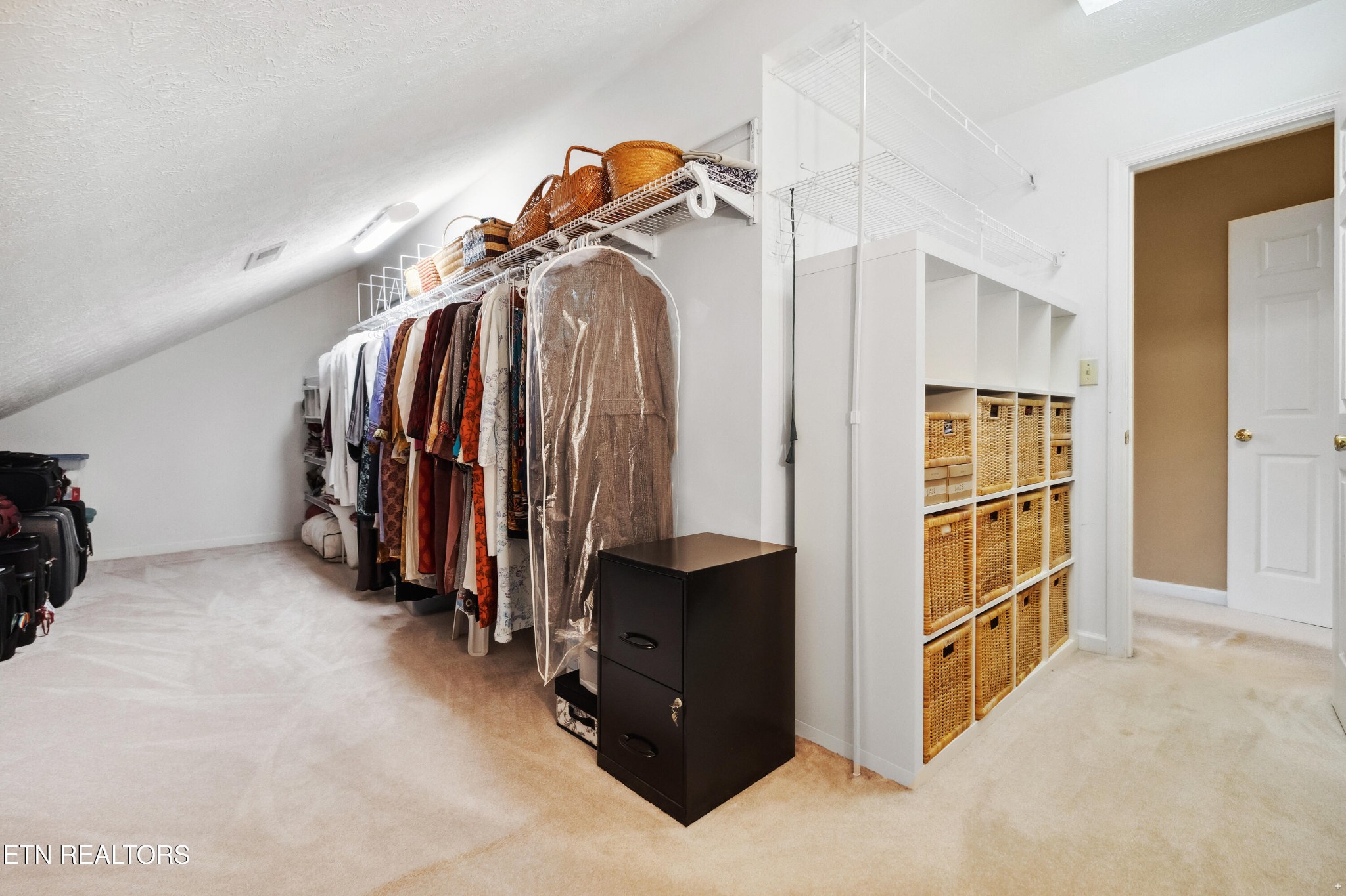 109 West Melbourne Road Oak Ridge, TN 37830 - Photo 23 of 31 a view of walk in closet with clothes and shoes