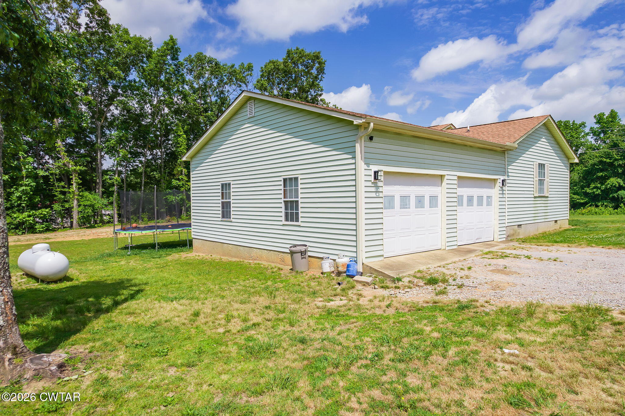 306 Jim Jackson Road Humboldt, TN 38343 - Photo 25 of 29 a view of a backyard with a garden and entertaining space