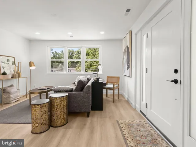 a view of a dining room with furniture kitchen and wooden floor
