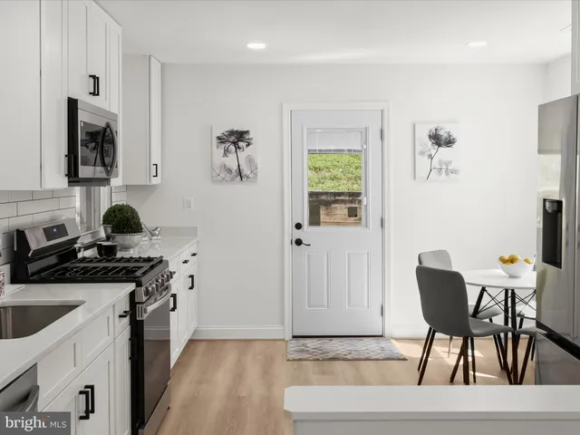 a workspace room with furniture and a window